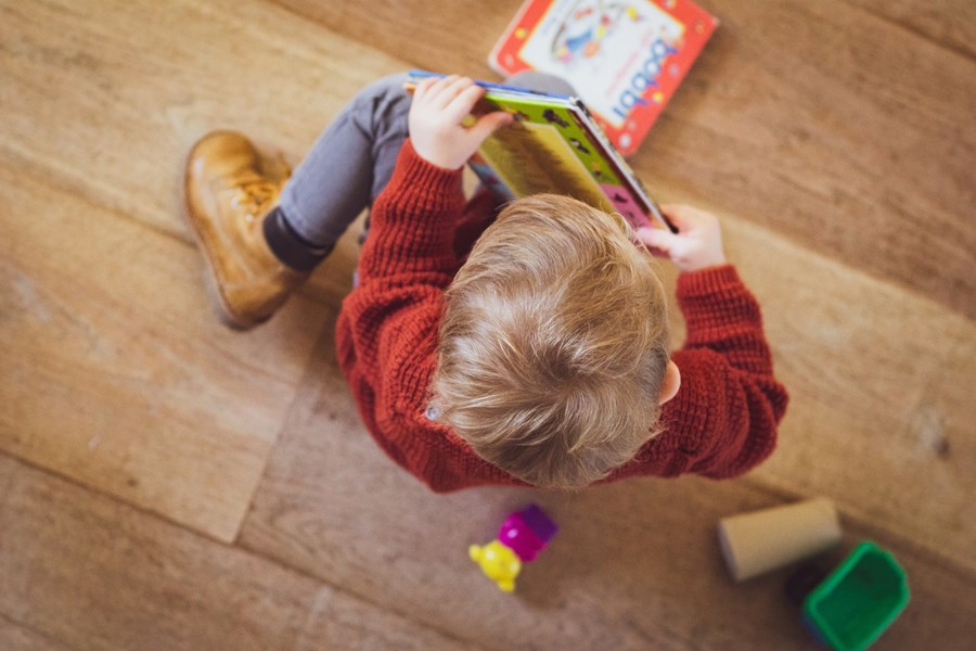 child holding a book