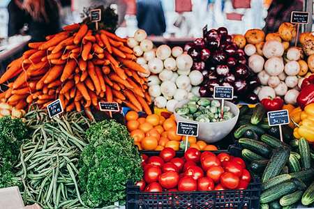 A variety of vegetables on display at a market.